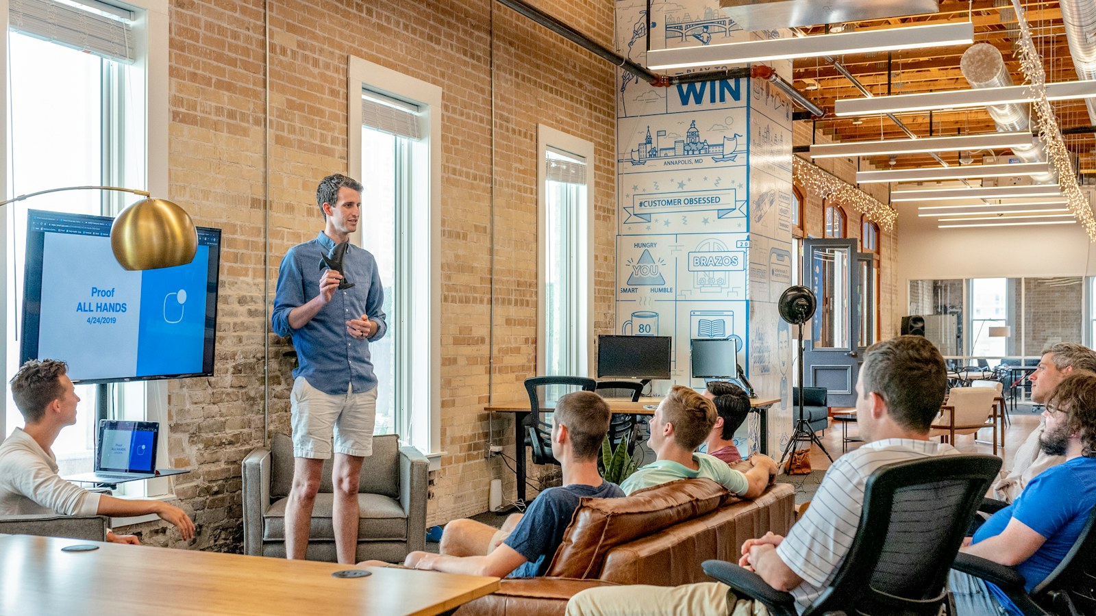 Agency team presenting a campaign strategy in a collaborative studio